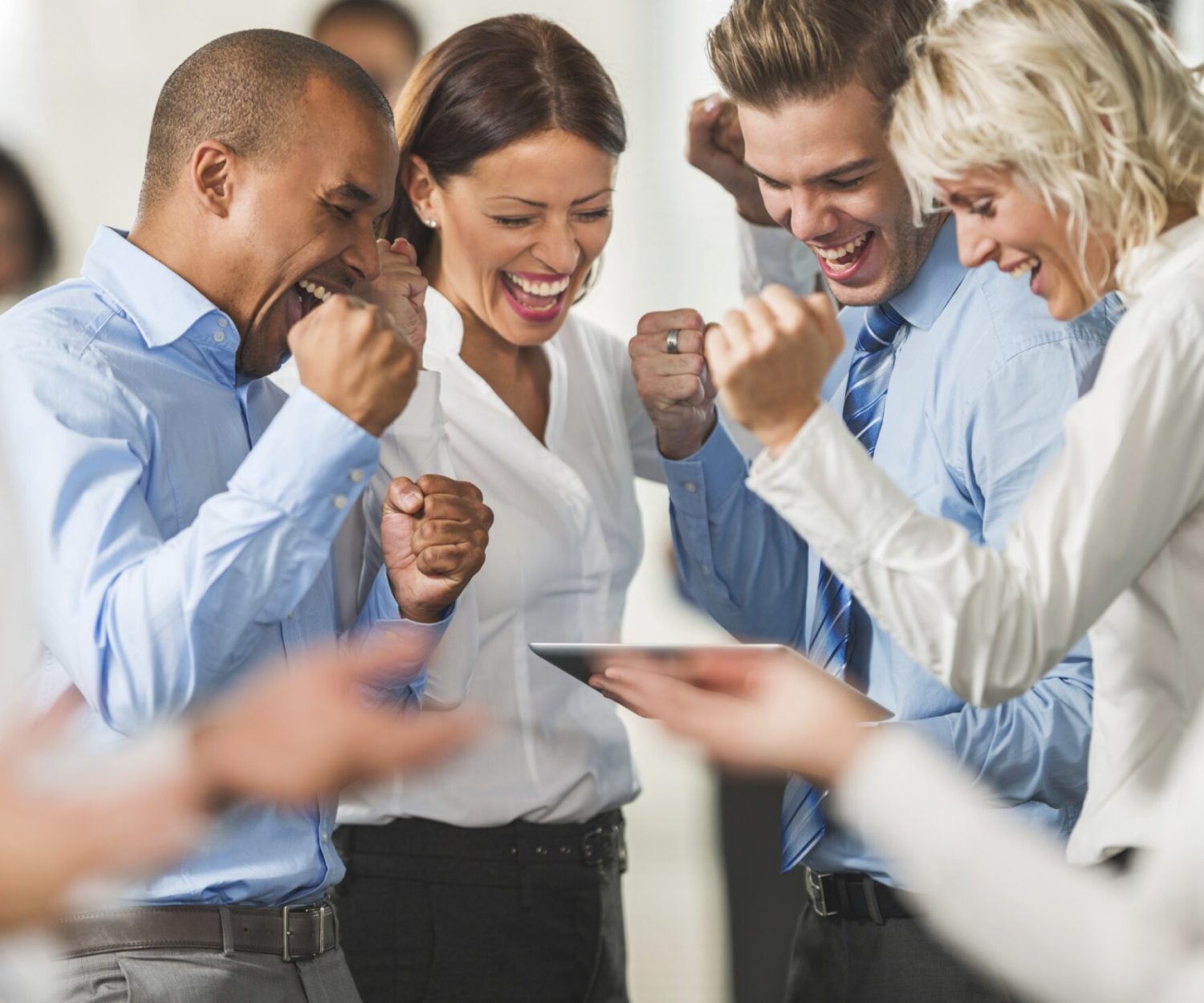 Group of cheerful business people using digital tablet. digital