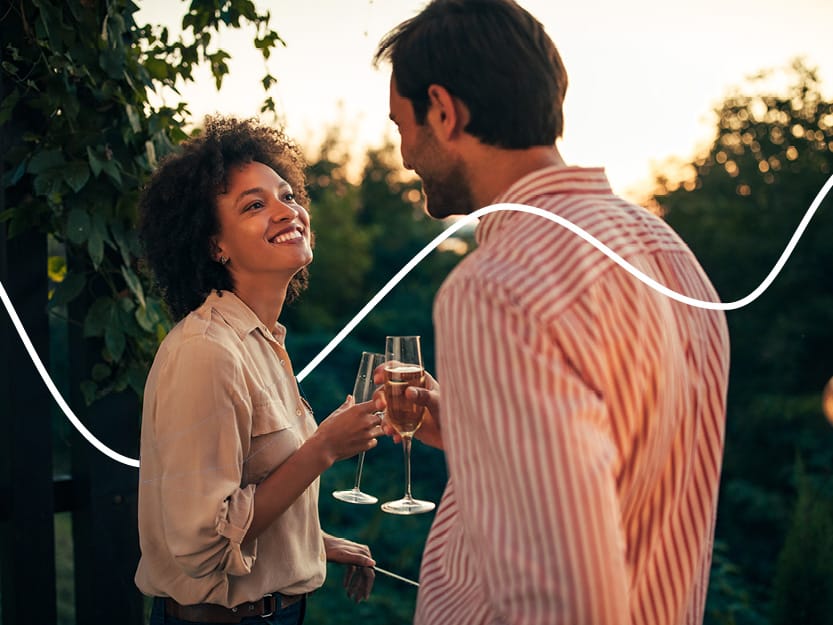 Shaping your wealth around you - Smiling couple with champagne
